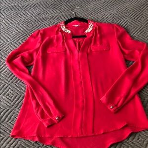 Fuchsia colored long sleeve blouse